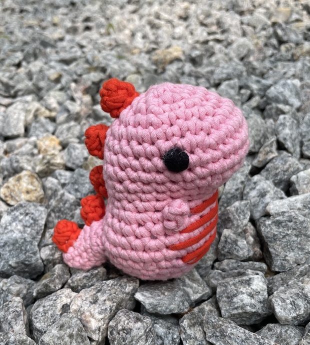 Fred the pink dinosaur crochet amigurumi plushie toy handmade craft finished object made from Woobles learn to crochet dinosaur kit