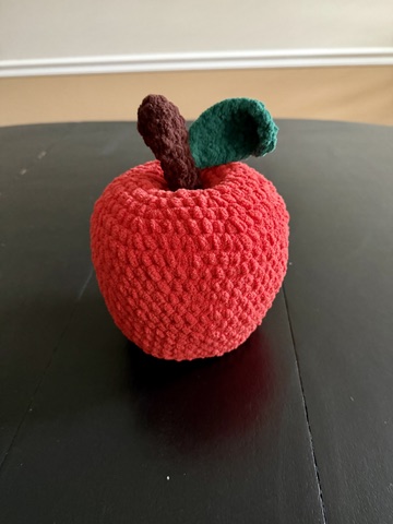 Large crocheted amigurumi apple plushie handmade finished object made with chenille yarn