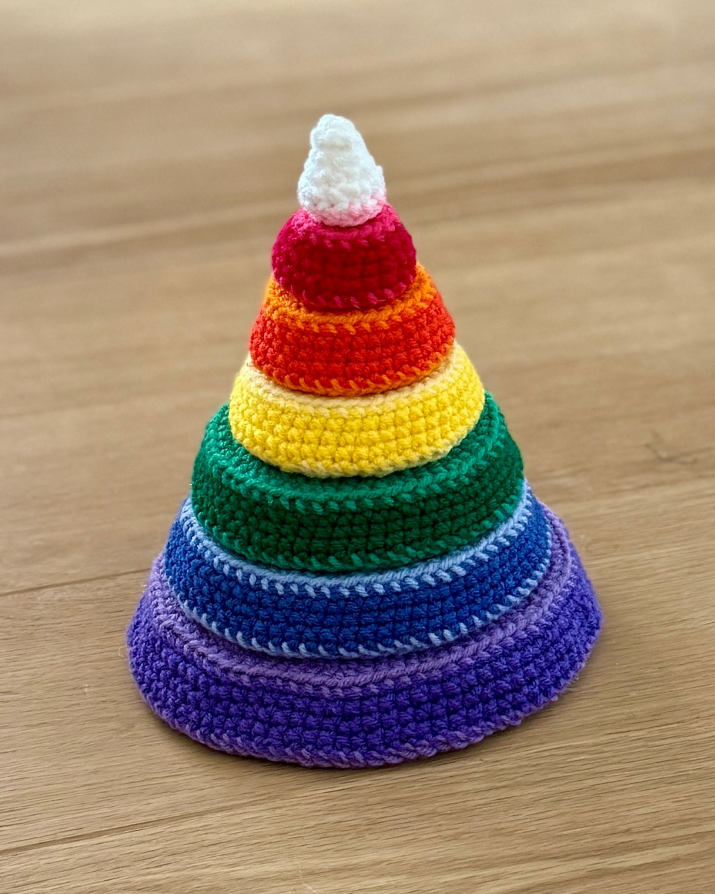 Stack-a-rainbow mountain crochet amigurumi handmade toy made up of colored slices that stack up to form a mountain