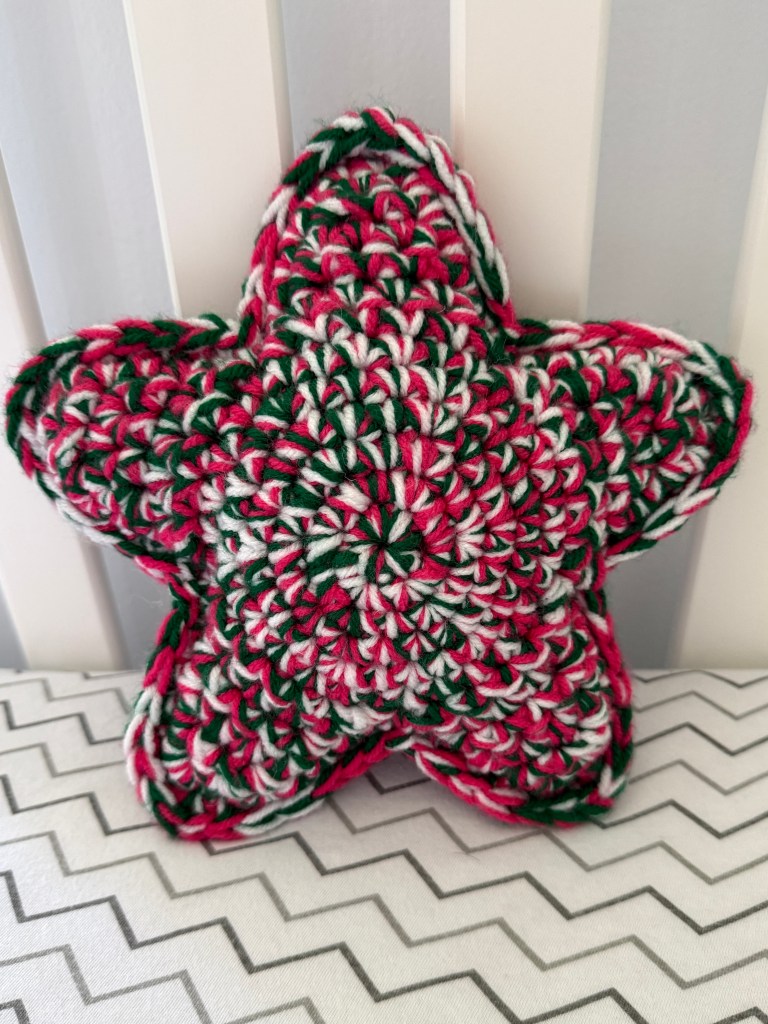 Marbled Star handmade crocheted amigurumi pillow plushy, made by marling 3 strands of yarn together -- Emerald Watermelon color palette (pink, green, and white)
