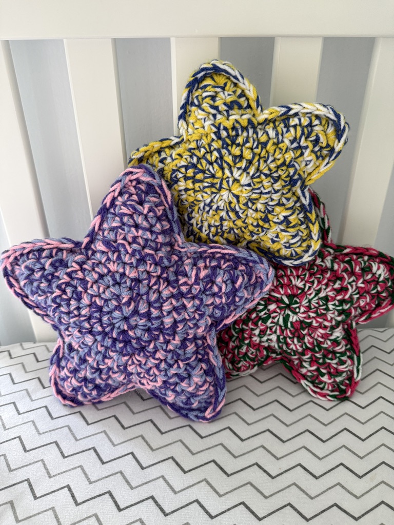 3 Marbled Star handmade crocheted amigurumi pillow plushies, made by marling 3 strands of yarn of different colors together
