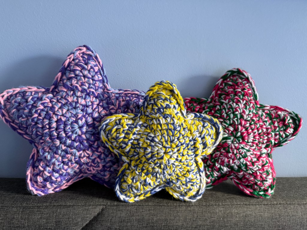 3 Marbled Star handmade crocheted amigurumi pillow plushies, made by marling 3 strands of yarn of different colors together