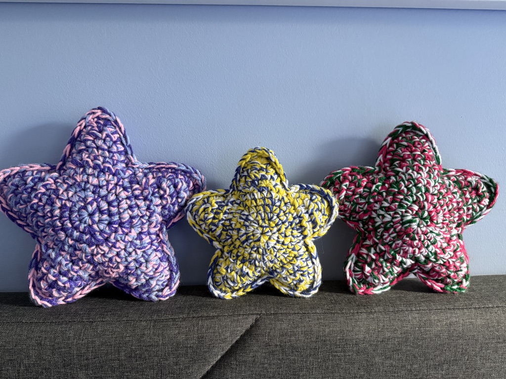 3 Marbled Star handmade crocheted amigurumi pillow plushies, made by marling 3 strands of yarn of different colors together