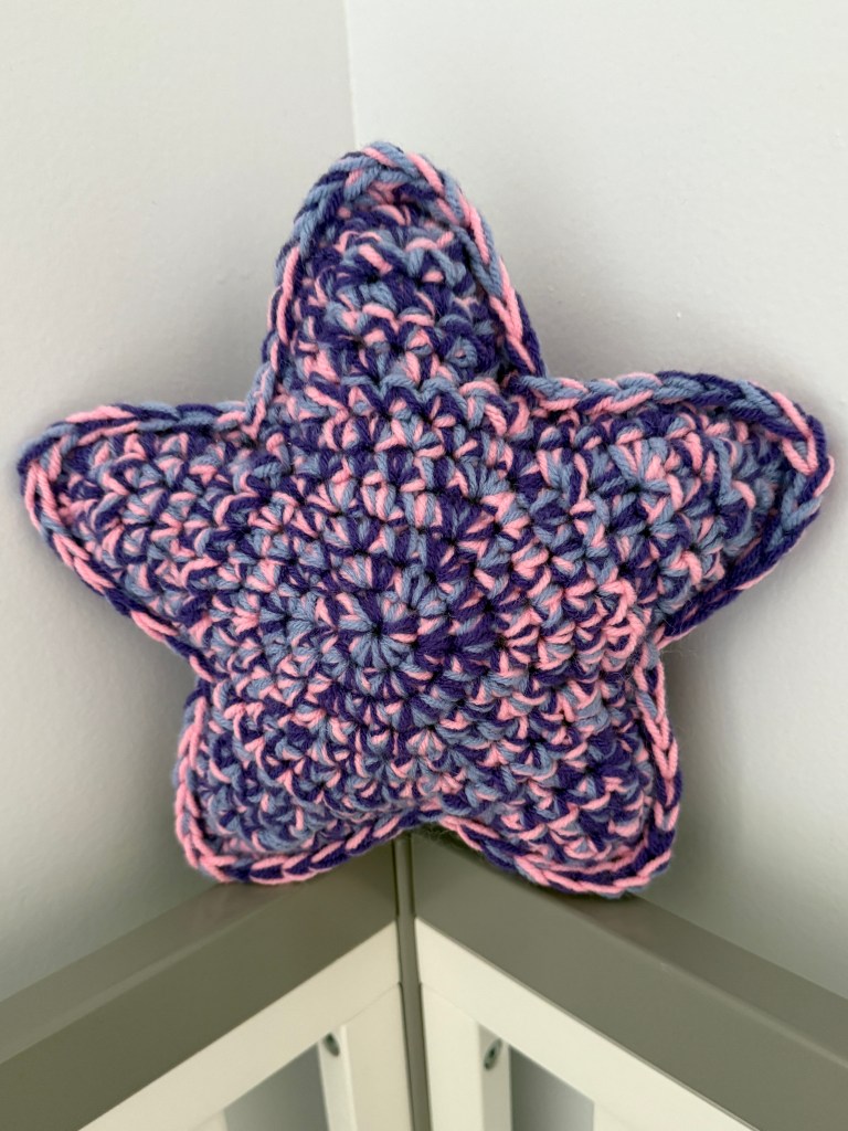 Marbled Star handmade crocheted amigurumi pillow plushy, made by marling 3 strands of yarn together -- Dreamy Midnight color palette (pink, periwinkle, and purple)