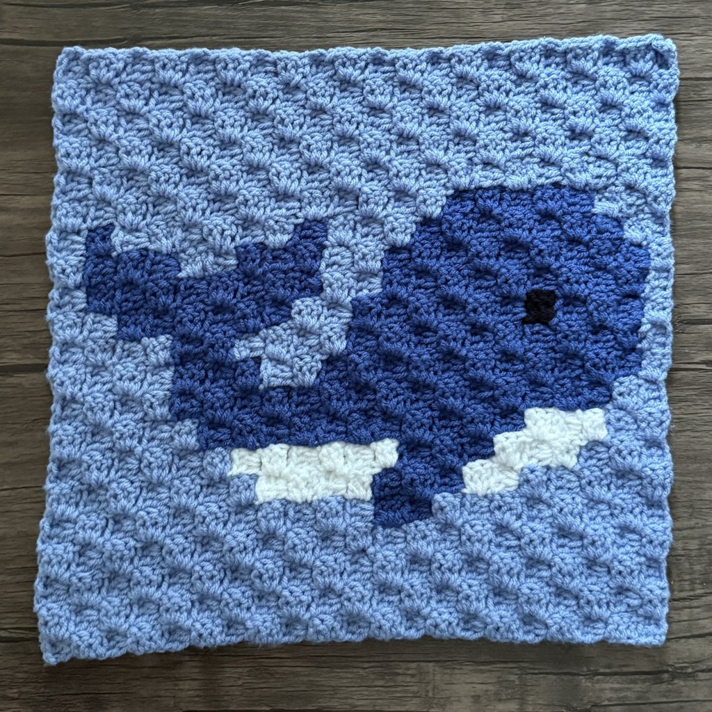 Blue whale motif crocheted on an individual C2C blanket square